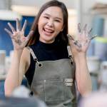 A warehouse worker smiling