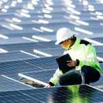 A technician setting up solar panel