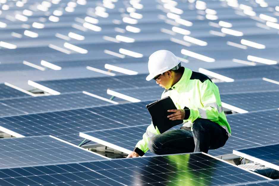 A technician setting up solar panel