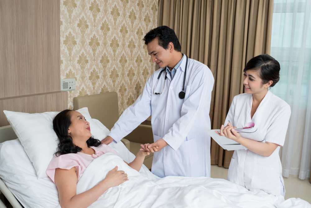 Doctors checking a female patient